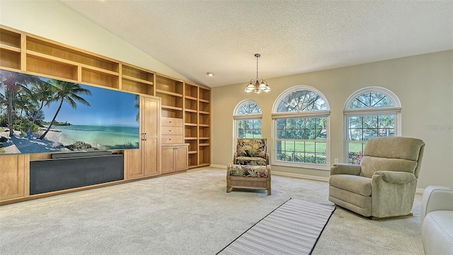 living room featuring a textured ceiling, carpet, an inviting chandelier, and vaulted ceiling