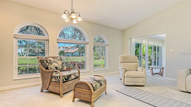 sitting room featuring light colored carpet, an inviting chandelier, and lofted ceiling