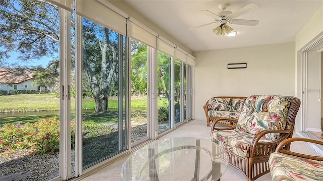 sunroom / solarium featuring ceiling fan