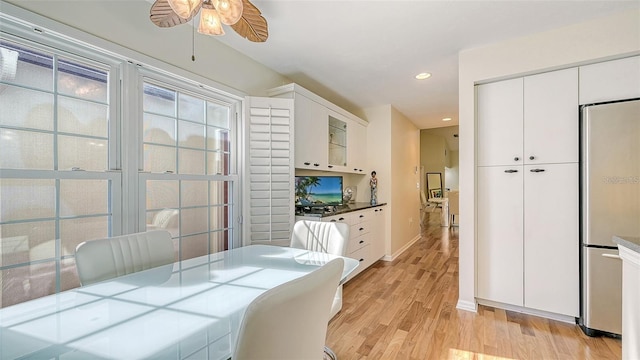 dining room featuring recessed lighting, light wood-style floors, baseboards, and ceiling fan