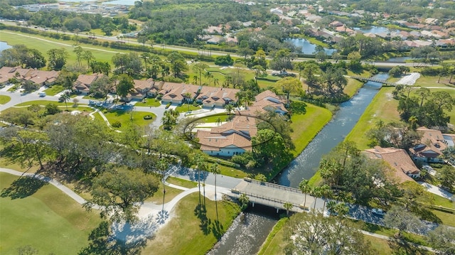 drone / aerial view featuring a residential view and a water view