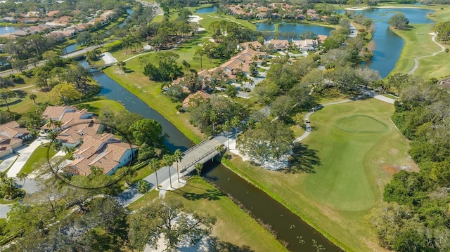 aerial view featuring a residential view, a water view, and view of golf course