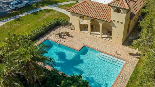 outdoor pool with a patio