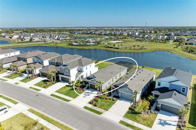 bird's eye view featuring a residential view and a water view