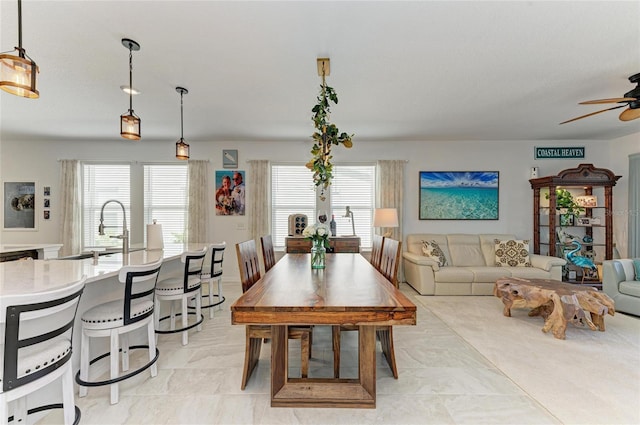 dining space featuring a ceiling fan