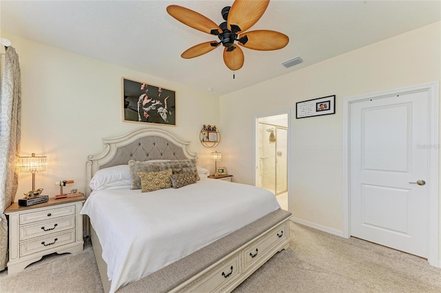 bedroom with visible vents, ensuite bathroom, baseboards, light colored carpet, and ceiling fan