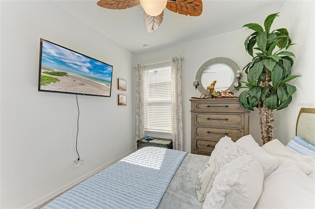 bedroom with baseboards and ceiling fan