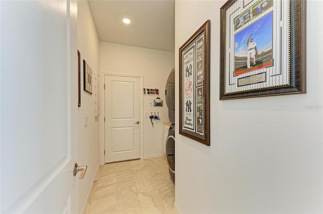 hall featuring arched walkways, recessed lighting, and baseboards