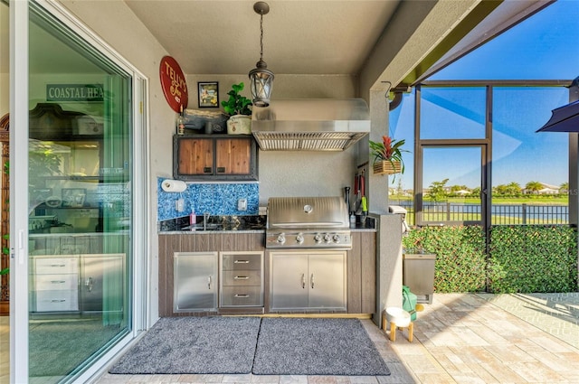 view of patio with a sink, grilling area, an outdoor kitchen, and a lanai