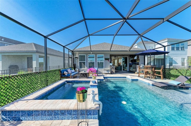 pool with an outdoor living space, glass enclosure, a patio, and a ceiling fan