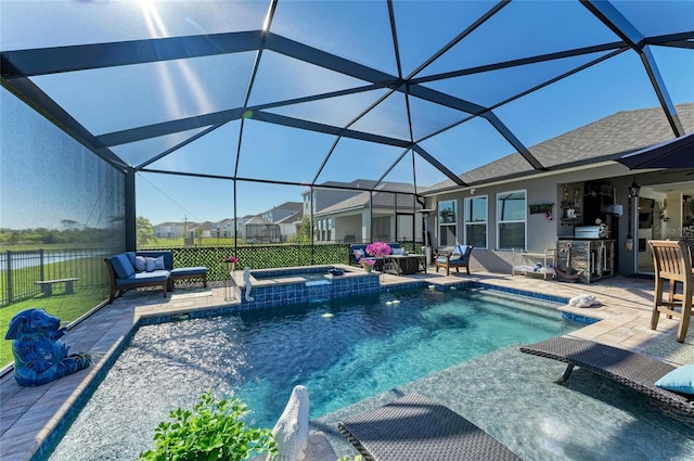 view of swimming pool featuring a pool with connected hot tub, a lanai, and a patio area