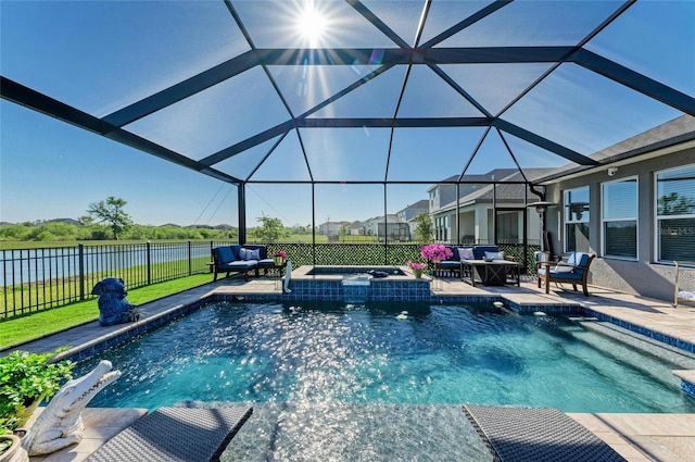 view of swimming pool with a water view, a pool with connected hot tub, fence, an outdoor hangout area, and a patio area