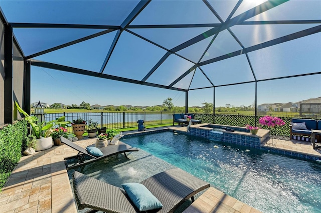 view of swimming pool with a patio area, a pool with connected hot tub, a water view, and fence