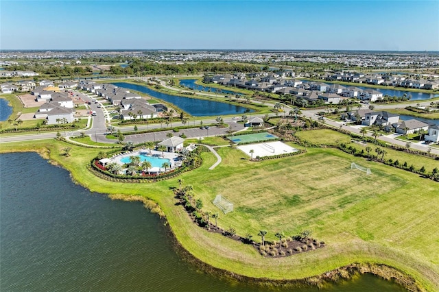 drone / aerial view featuring a residential view and a water view