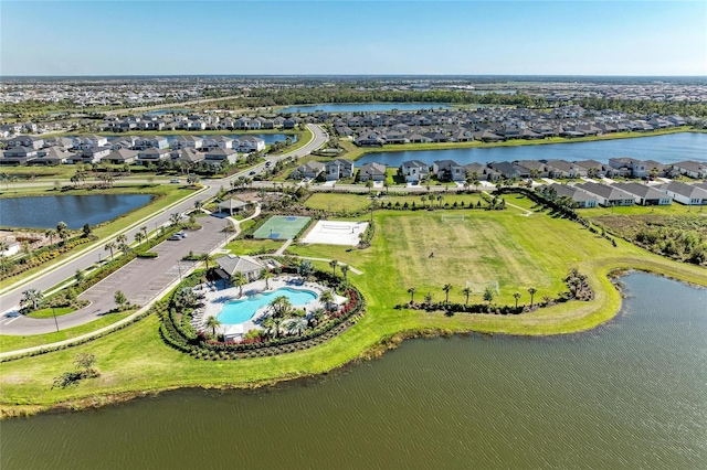 birds eye view of property featuring a residential view and a water view