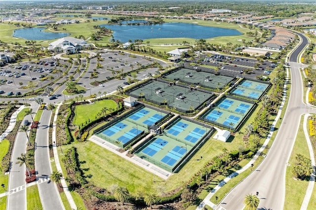 birds eye view of property with a water view