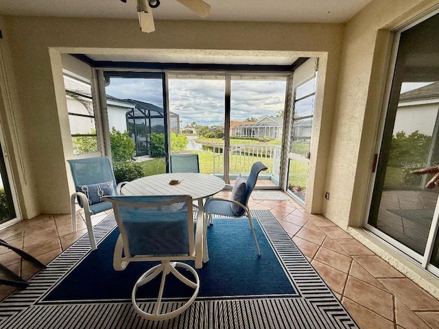 sunroom with a ceiling fan