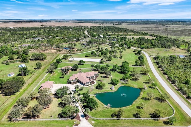 aerial view with a rural view and a water view