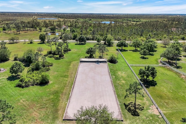 bird's eye view with a forest view and a water view