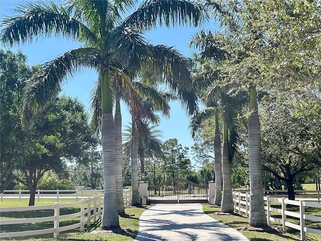 view of community with a gate and fence