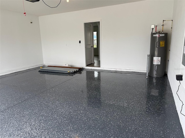 garage featuring electric water heater and a garage door opener