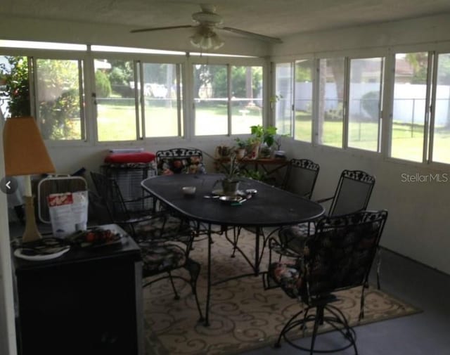 sunroom / solarium with ceiling fan