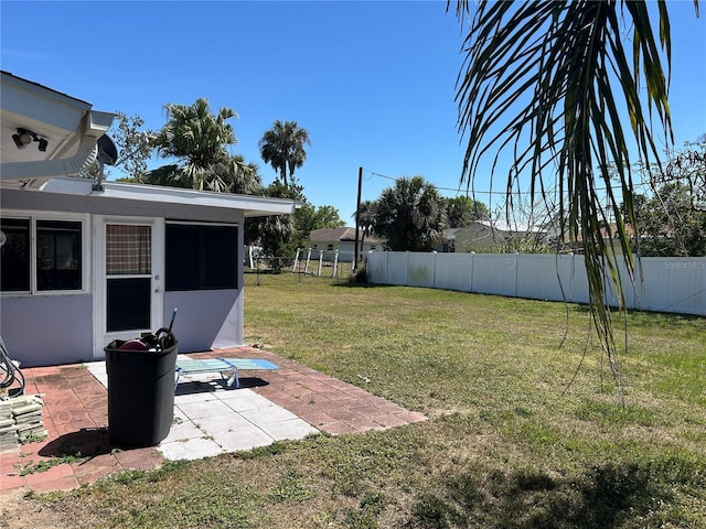 view of yard featuring a patio area and a fenced backyard