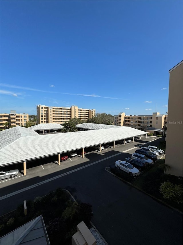 exterior space with a view of city and a parking lot