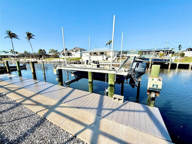 dock area featuring a water view and boat lift