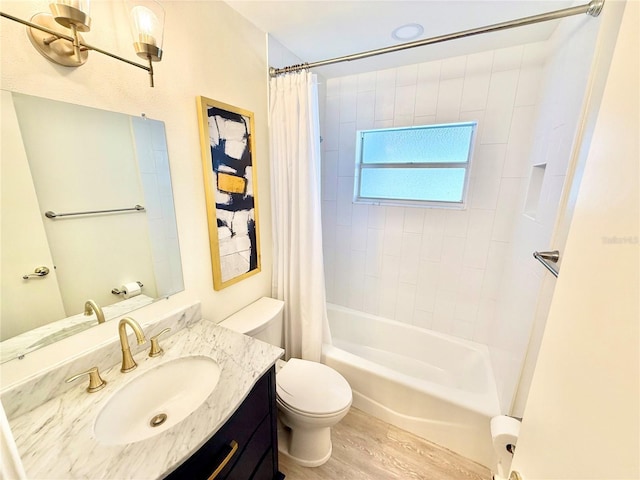 full bathroom featuring vanity, shower / tub combo, toilet, and wood finished floors