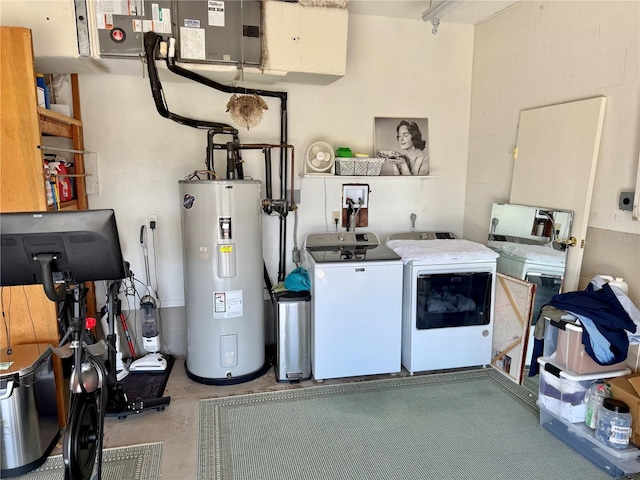 interior space with washing machine and clothes dryer and electric water heater