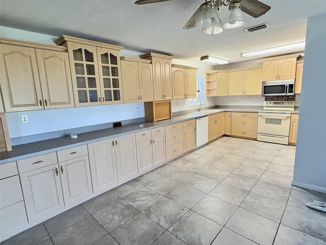 kitchen featuring visible vents, a ceiling fan, light brown cabinetry, open shelves, and white appliances