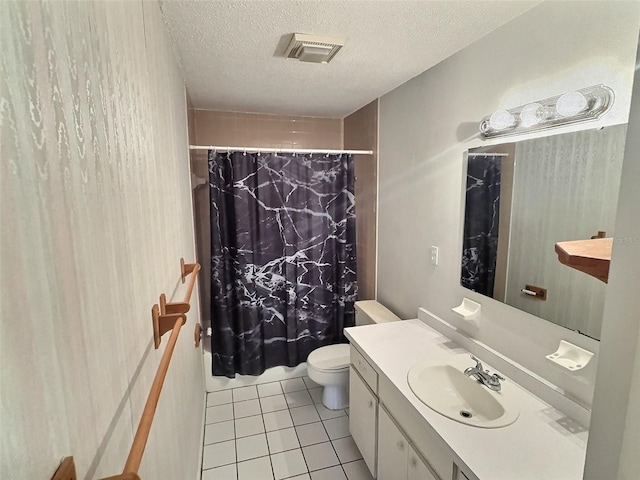 bathroom with visible vents, a shower with curtain, toilet, tile patterned flooring, and vanity