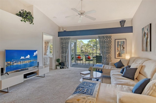 living area featuring ceiling fan, carpet flooring, and vaulted ceiling