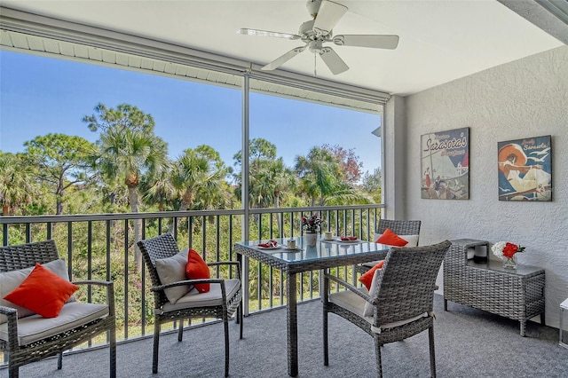 sunroom with a ceiling fan