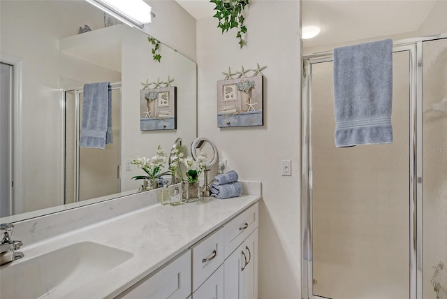 full bathroom with vanity and a shower stall