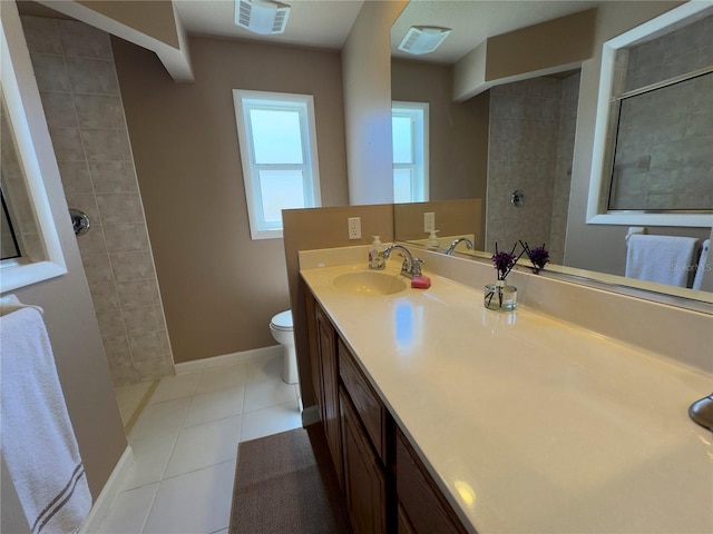 bathroom with visible vents, toilet, tile patterned flooring, walk in shower, and vanity