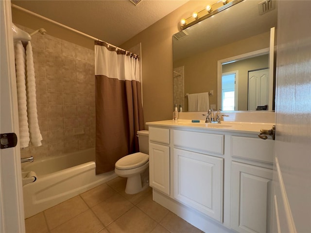 bathroom with tile patterned flooring, visible vents, toilet, shower / bath combo with shower curtain, and vanity