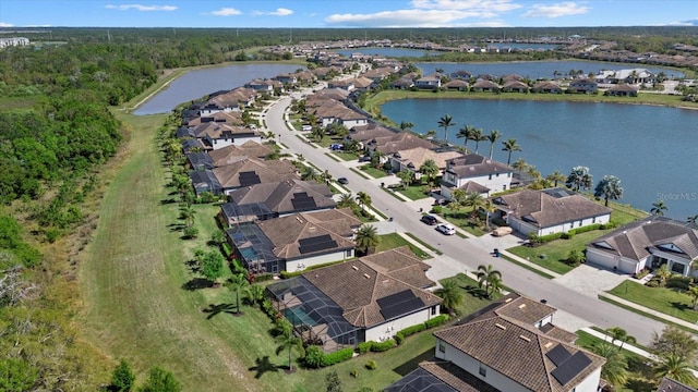 bird's eye view with a residential view and a water view