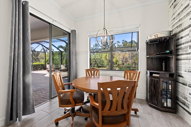 dining area featuring crown molding and a chandelier