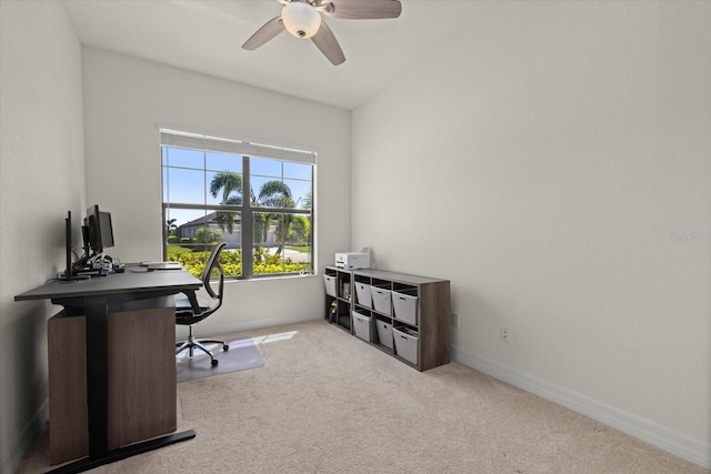 office space featuring a ceiling fan, carpet, and baseboards