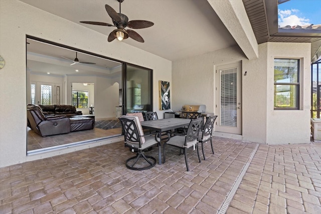 view of patio featuring outdoor dining space and ceiling fan
