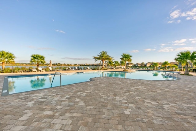 community pool with a patio area