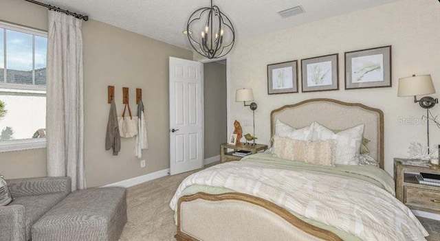 bedroom featuring visible vents, baseboards, carpet, a notable chandelier, and a textured ceiling