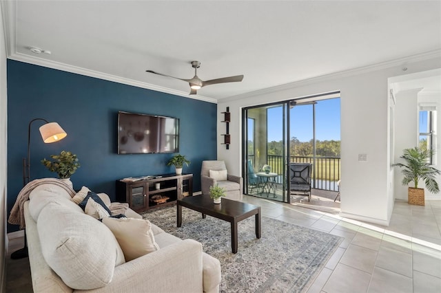 tiled living area featuring plenty of natural light, a ceiling fan, and ornamental molding