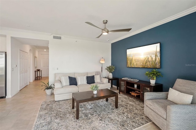 living area featuring light tile patterned floors, visible vents, crown molding, and ceiling fan