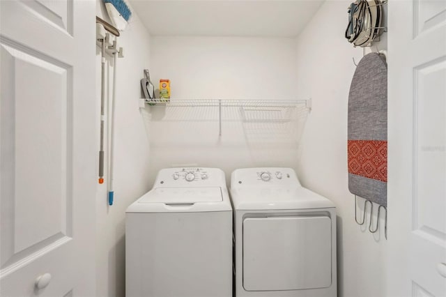 laundry area featuring laundry area and washing machine and clothes dryer