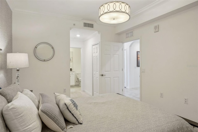 bedroom featuring visible vents, arched walkways, and crown molding