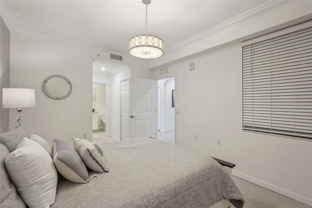 carpeted bedroom featuring connected bathroom, baseboards, visible vents, and ornamental molding