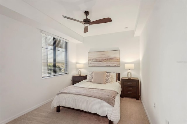 carpeted bedroom with baseboards and ceiling fan